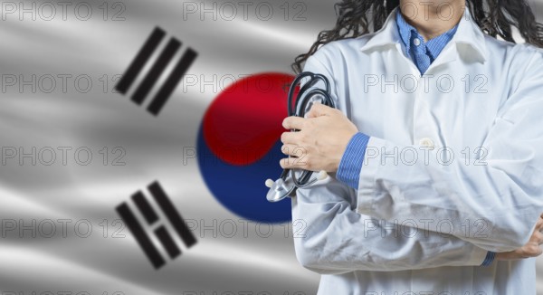Healthcare professional with South Korea flag background. Professional doctor holding stethoscope