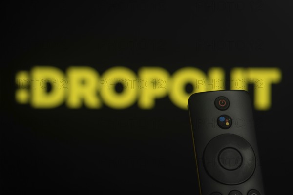 Dhaka, Bangladesh- 21 Jan 2026: Close-up of a smart TV remote control against a blurred Dropout