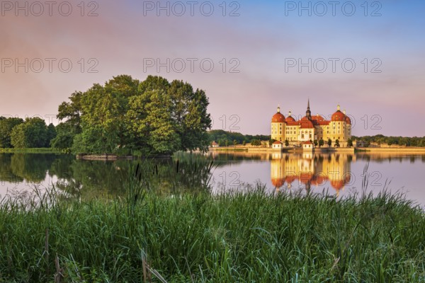 Moritzburg Castle, Augusts the Strong hunting lodge in the evening light, water reflection in the