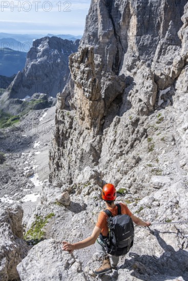 Mountaineers on the Bocchette Centrale band trail, via ferrata in the Brenta Mountains,