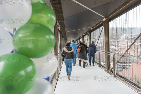 A walkway with people and balloons overlooks the city, opening of the Hermann Hesse Railway, Calw,