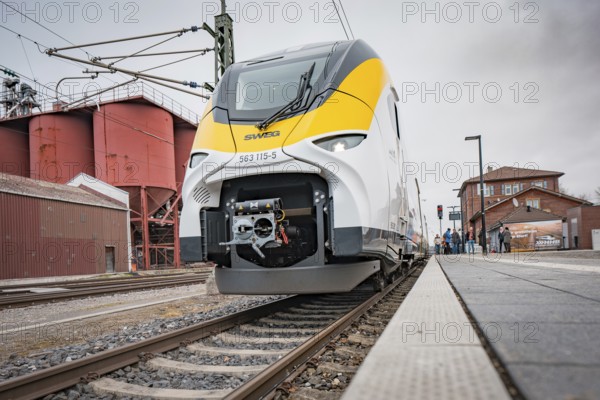 Modern train on the tracks with technical details in the foreground, Siemens Micro Plus B battery