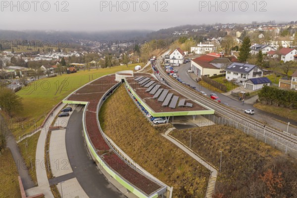 Hill with solar panels and roads in an urban residential area, opening of the Hermann Hesse