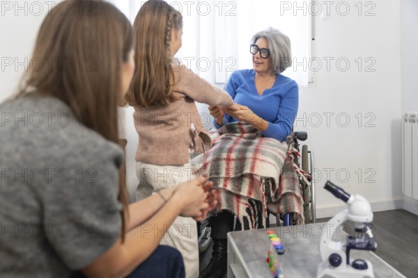 Family members, including a young girl and her mother, are visiting an elderly grandmother in a