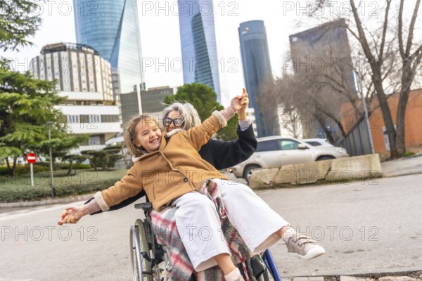 Loving grandmother and granddaughter sharing a joyful moment, playing together while enjoying an