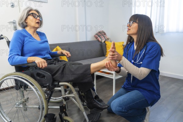 Medical professional performing a foot massage and rehabilitation exercises on an elderly patient