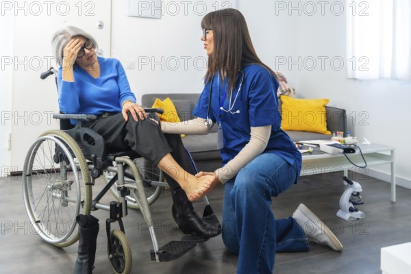 Medical professional providing physical therapy and attentive care to an elderly patient