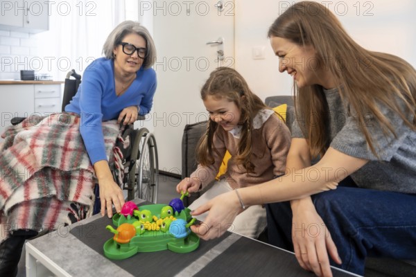Happy multi generational family playing a fun board game together, connecting and sharing joyful
