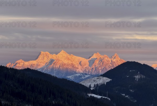Alpine glow at sunset, mountain peaks of the Loferer Steinberge in winter, Kitzbühel Alps, Tyrol,