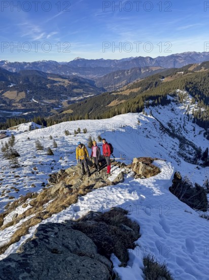 Three friends hiking trail to the summit of Feldalphorn, winter hiking, Kitzbühel Alps, Tyrol,