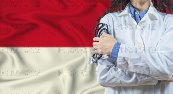 Healthcare professional with Indonesia flag background. Professional doctor holding stethoscope on