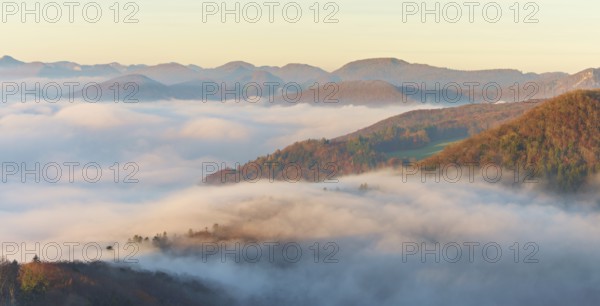 View from the Gisliflue of the Jura foothills covered in fog in morning light, Talheim, Canton,