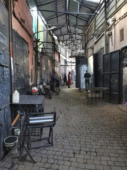 A covered alley in a medina in an artisan district, atmospheric, Morocco