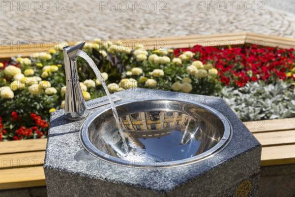 Drinking fountain on the main market square, reflecting the town hall, Bautzen, Upper Lusatia,