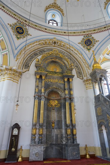 Richly decorated interior of a mosque with marble columns and gilded details, Aziziye Mosque,