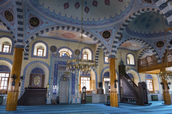 Bright mosque interior with ornate blue ornaments and majestic dome, Kapu Mosque, Ottoman era