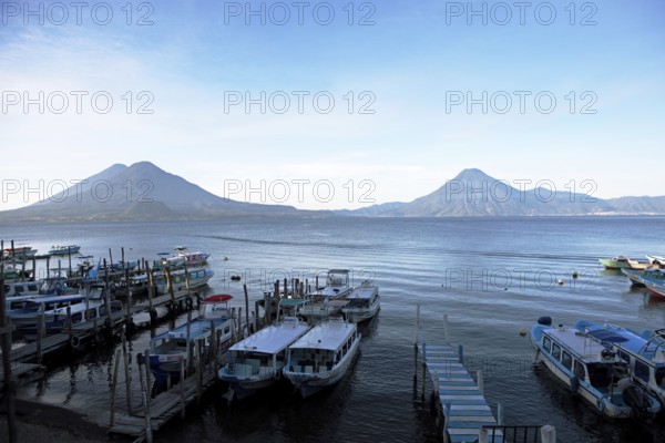 Boats on the pier, Lake Atitlán or Lake Atitlán in the morning, the volcanoes San Pedro, Atitlán