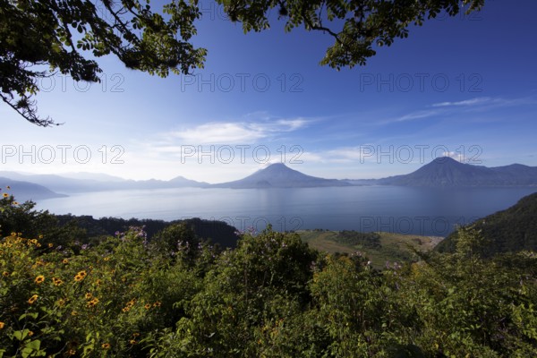 Lake Atitlán or Lake Atitlán in the morning, in the back the volcanoes San Pedro, Atitlán and