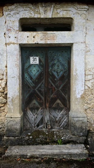 Weathered wooden garden door with an old, mysterious charm, rural style
