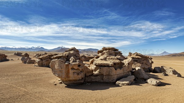 Impressive rock formations in a sandy desert landscape under clear skies, The landscape of the