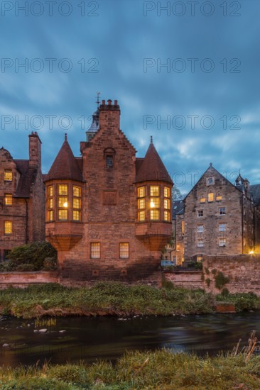 Dean Village, Edinburgh, Scotland, UK. Traditional houses and church with canal in historic Dean