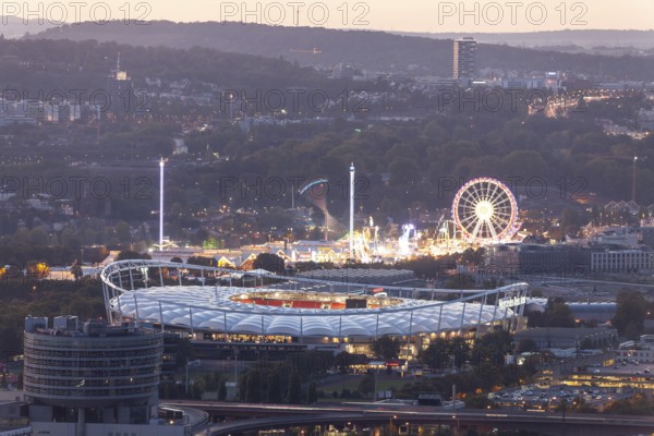 29 Sep 2018 at dusk, Volksfest lights seen from Rotenberg chapel with stadium foreground and