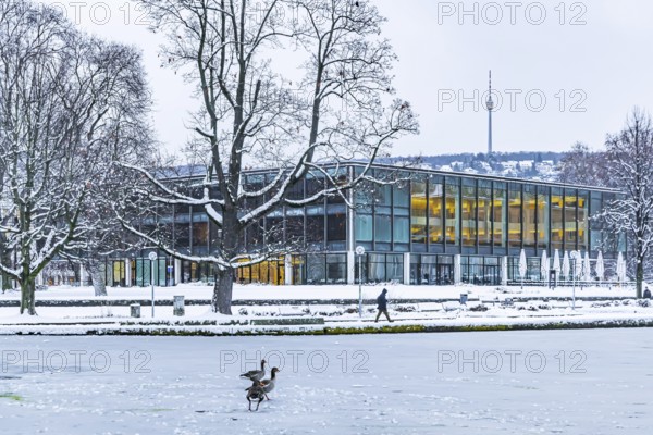 Exterior view of the state parliament building with Eckensee and television tower. Winter in