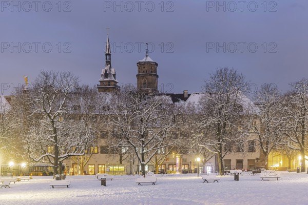 Winter in Stuttgart. The city is wintry white early in the morning. Castle square with collegiate