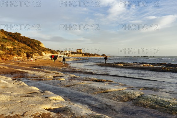 Walkers on the beach, Lido Scala dei Turchi, Realmonte, Agrigento, Sicily, south coast,