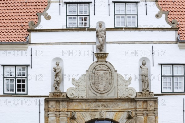 Torhaus am palace gardens, façade with figure and coat of arms, Husum, North Frisia,