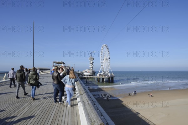 Pier with bungy jumping tower and Ferris wheel, Scheveningen, The Hague, Dutch North Sea Coast,