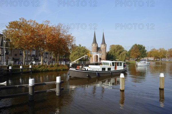 Oostpoort city gate and ship on the Delftse Schie, Delft, South Holland, Netherlands