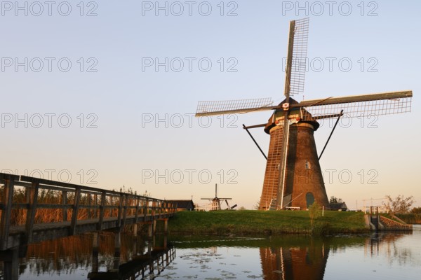 Historic windmills in the evening light, UNESCO World Heritage Site, Kinderdijk, South Holland,
