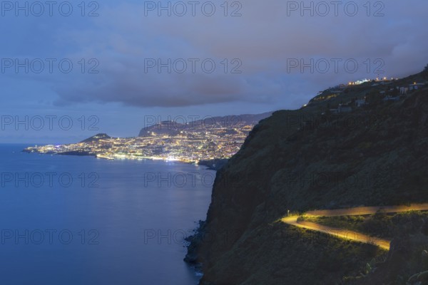 View of the Atlantic Ocean from Christo Rei viewpoint at dusk, harbour with cruise ships and