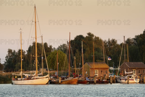 Sunset with boat on the lagoon near Gager on Rügen, Rügen, Gager, Mecklenburg-Western Pomerania,