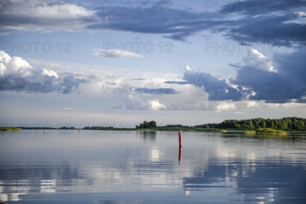Fairway to Ekenäs harbour with sea mark on Lake Vänern, water reflecting the sky, Ekenäs,