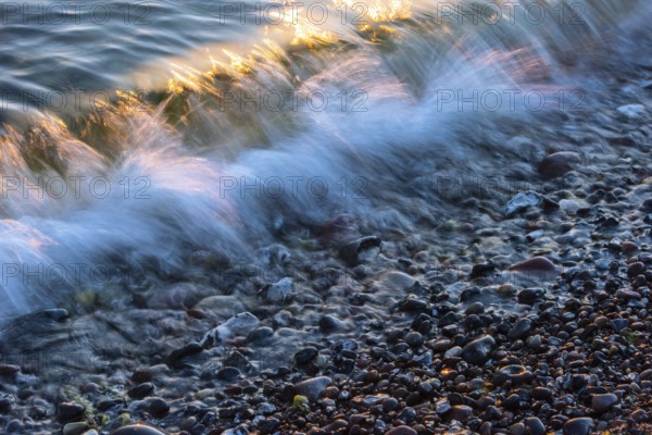 Wave play at sunrise on the chalk coast in Jasmund National Park, Rügen, Sassnitz,