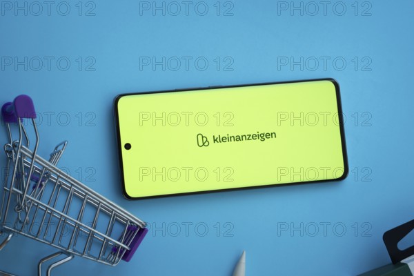 Dhaka, Bangladesh- 03 July 2025: Smartphone displaying Kleinanzeigen logo with shopping cart on a