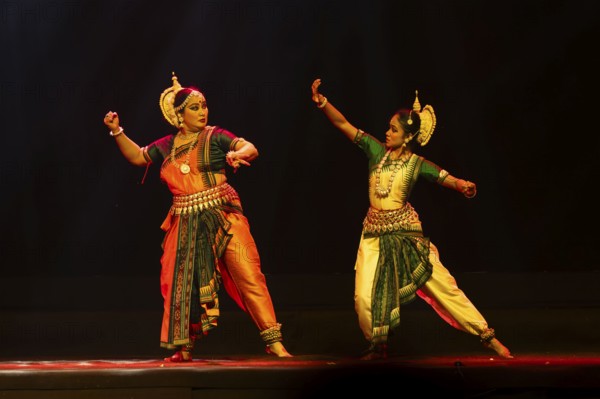 Artists perform Odissi classical dance during a cultural evening program at Shilpgram Mohotsav 2026