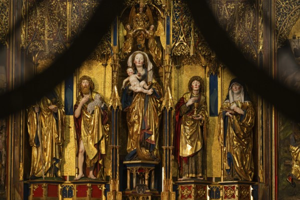 Mother of God on the crescent moon with baby Jesus, elevated on a pedestal, left and right John the
