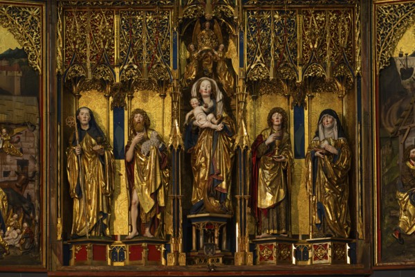 Mother of God on the crescent moon with baby Jesus, elevated on a pedestal, left and right John the