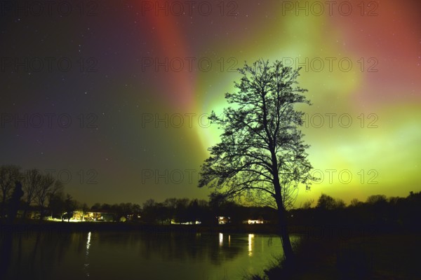 Northern lights, northern lights, on a lake in Schleswig-Holstein, Germany