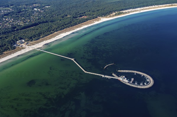 Aerial view over Seebrücke, pier and marina with boats at seaside resort Prerow along the Baltic