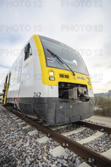 Close-up of a modern SWEG train on the rails, taking off the Hermann Hesse Railway, Calw, Black