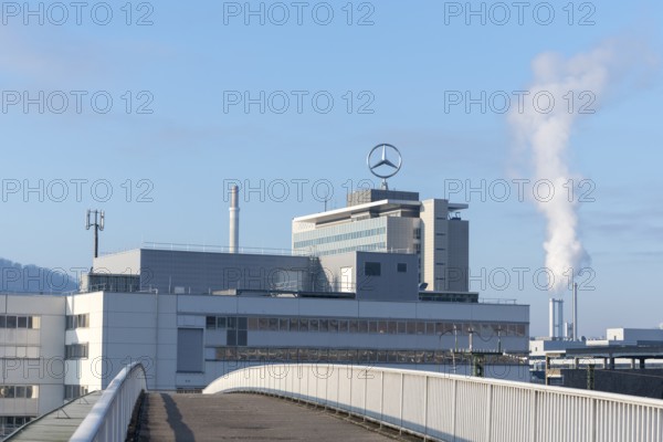 Building with Mercedes logo and rising steam, bridge in the foreground, Mercedes Star,