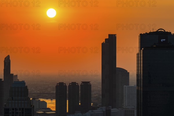 Over the rooftops of Bangkok, sunset, view from the Moon Bar on the roof terrace of the Banyan Tree