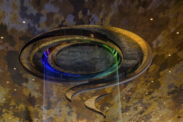 Artificial, brightly lit waterfall, Magic Waterfall, falls from the ceiling of the Iconsiam