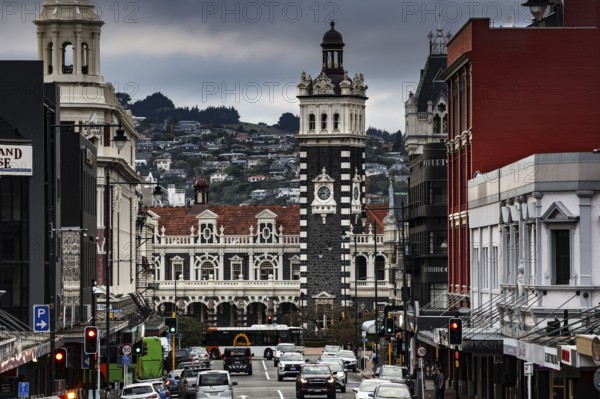 Historic train station surrounded by busy streets and distinctive architecture in Dunedin, Dunedin,