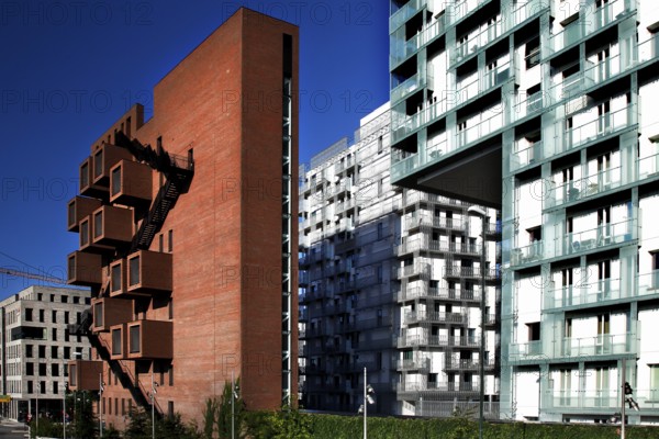 Modern new buildings in Oslo with brick and glass facades under clear blue skies, Oslo, Bydel Gamle