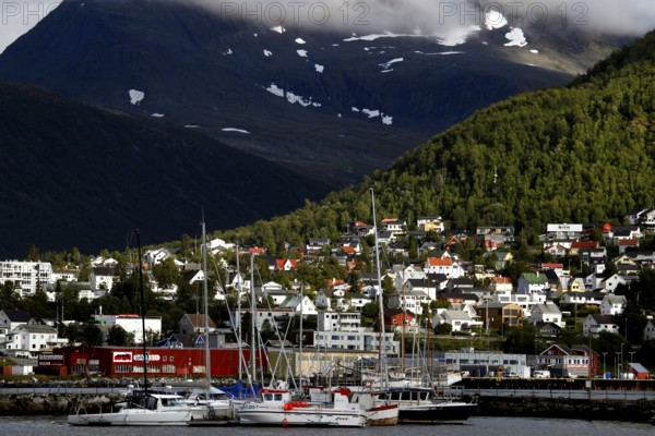 View of Tromsdalen with colorful buildings and rugged mountains, Tromsø, Troms, Norway
